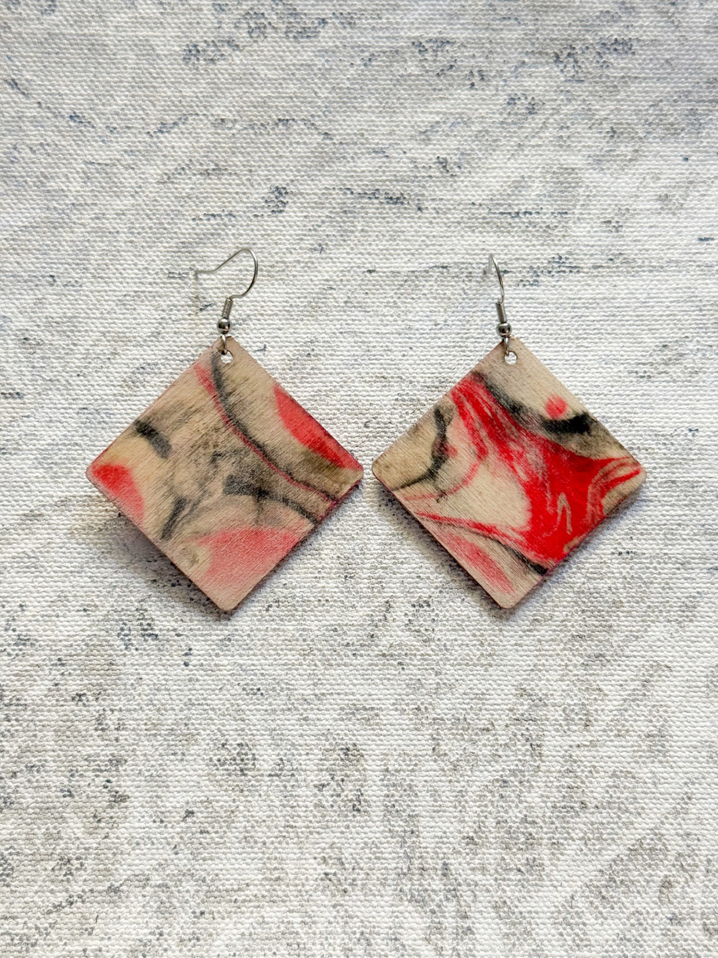 Lightweight earrings made in the UK bespoke individual one of a kind red cream and black abstract