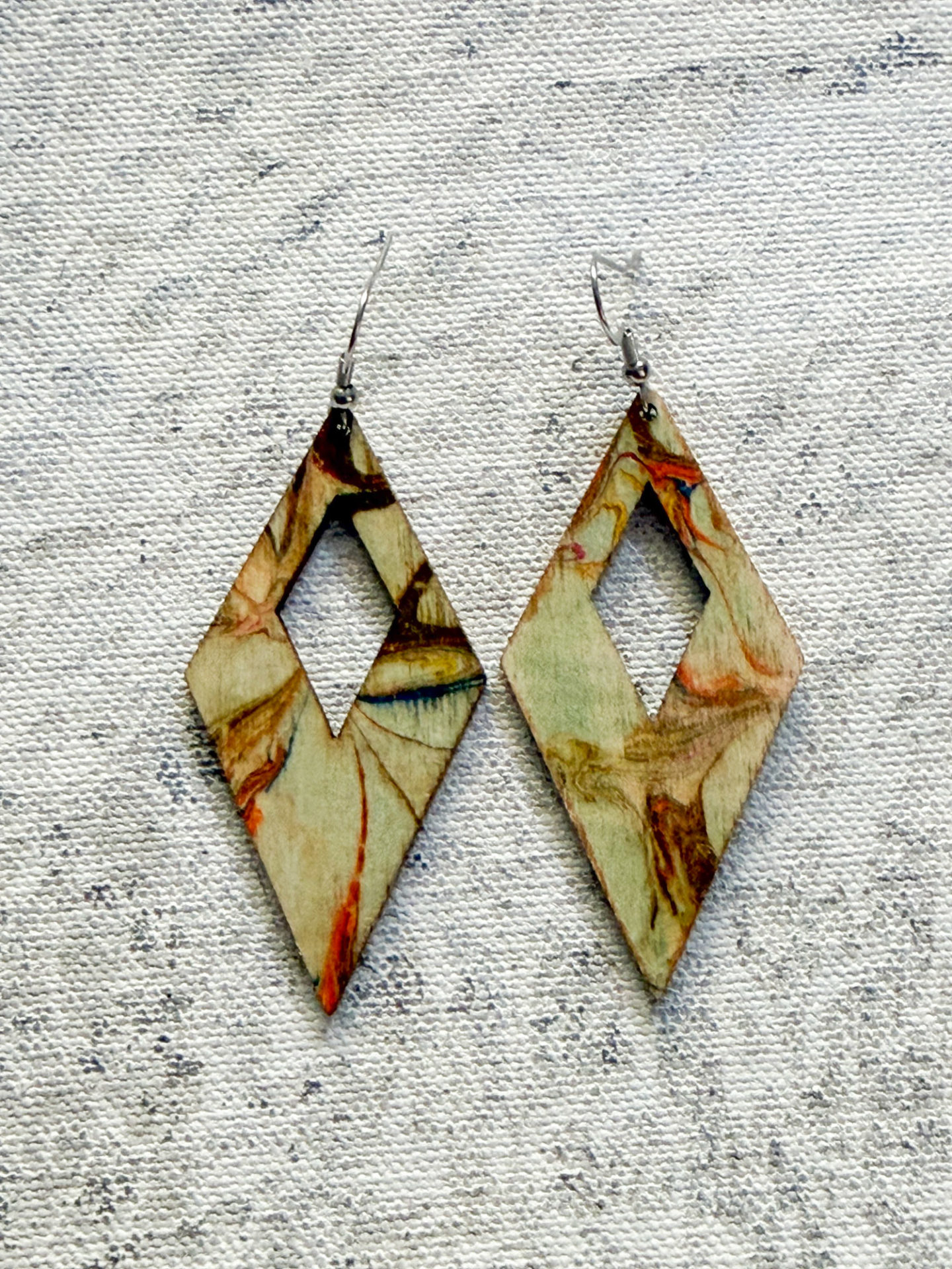 Individually created beige neurtral natural looking one of a kind diamond shape earrings by British artist